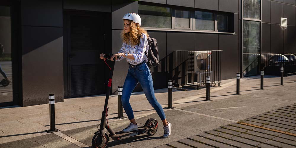 woman riding a scooter