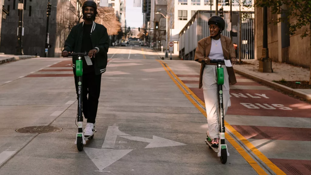 two people on bird scooters
