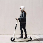 a woman on a bird scooter